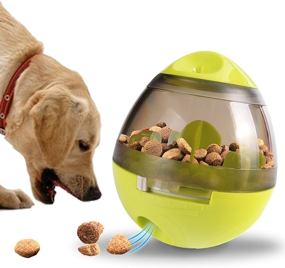Dog playing with a treat-dispensing ball